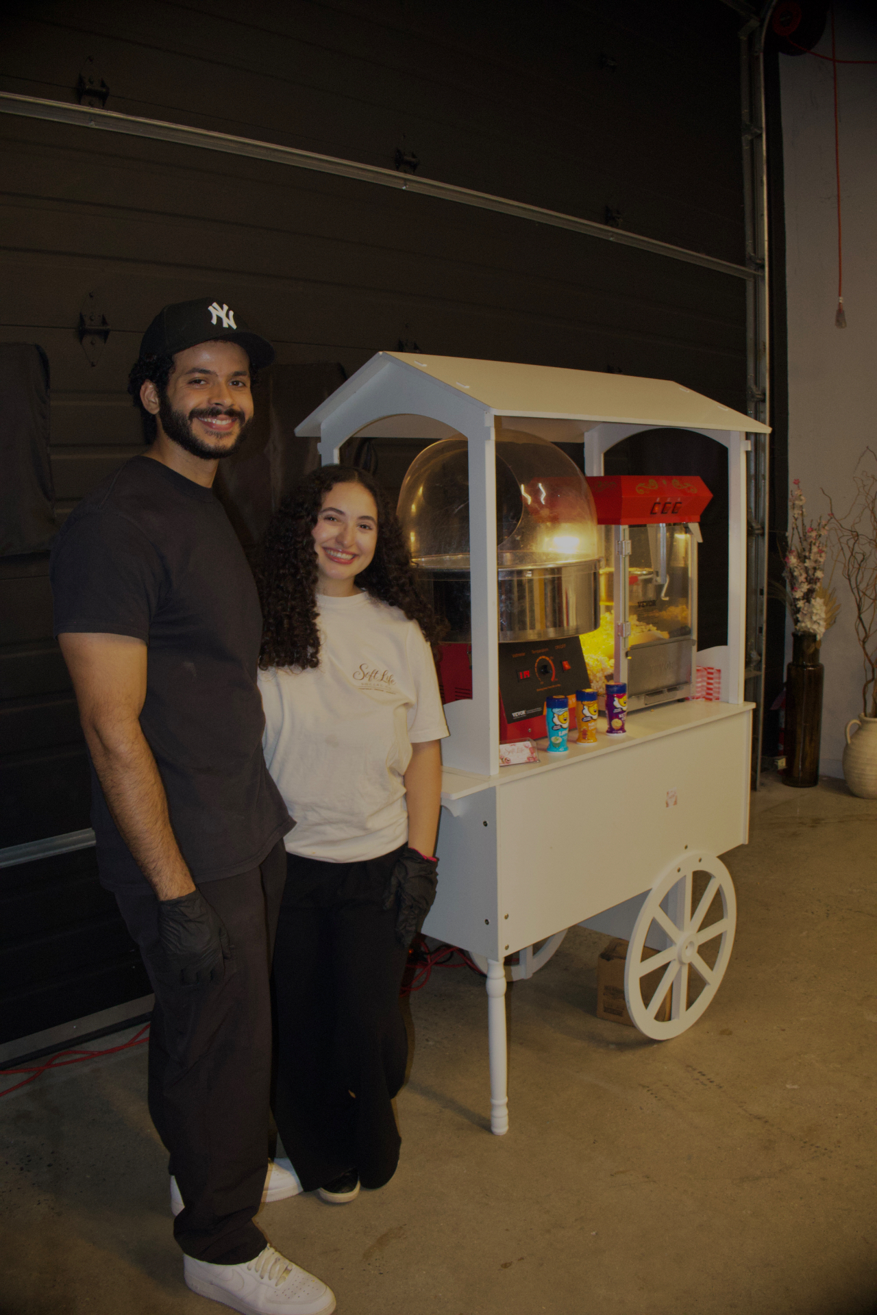 The Soft Life Social Co. owners with their white concession cart
